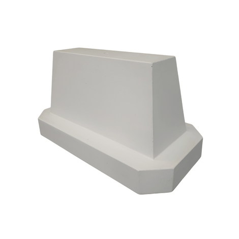 Grijs betonnen afzetblok van 175 kg met hijspunt, trapeziumvormig met brede basis.