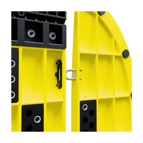 Gele kunststof sleufbrug koppelsysteem met zwarte tussen- en eindstukken, detail van de verbinding.